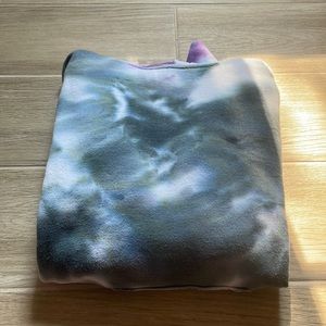 Tie dyed sweatshirt. Rainbow on the sleeves and pocket. Black + white in middle.